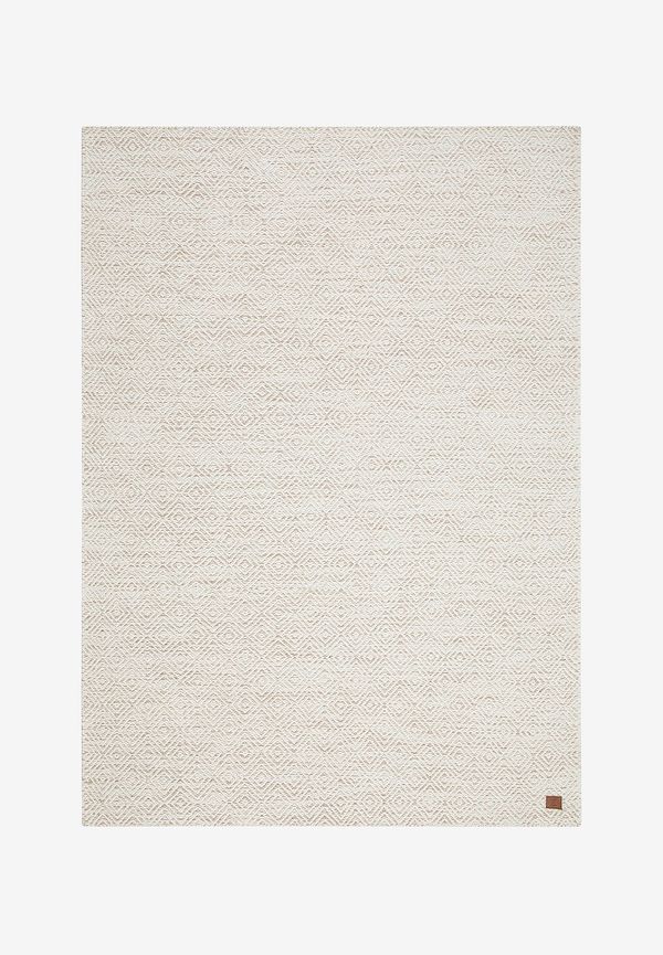 Exklusiv km home matta i beige färg gjord i ull.