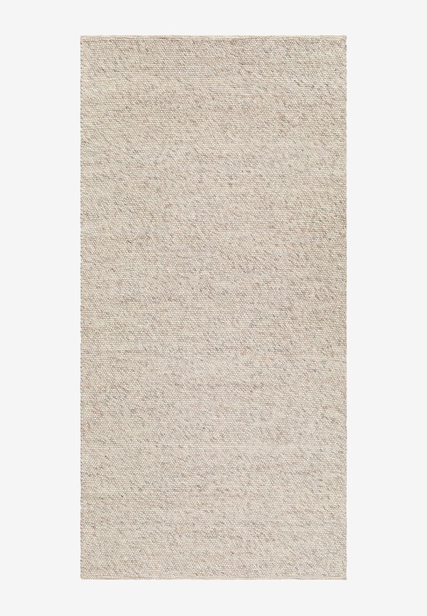 Superfin km home matta i beige färg gjord i ull.