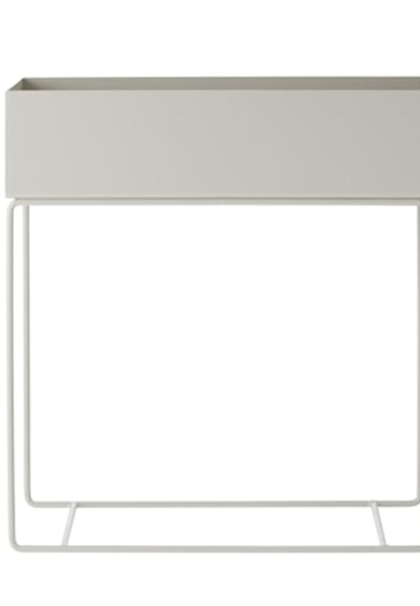 Grå FERM LIVING-sidobord i ikonisk modell.