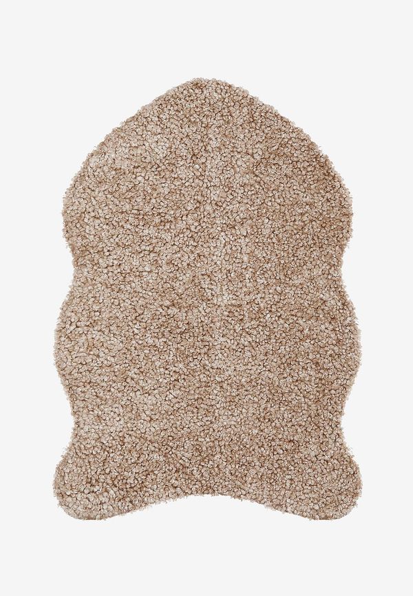 Skinnwille fårskinnsmatta som passar perfekt till sommaren 2025!