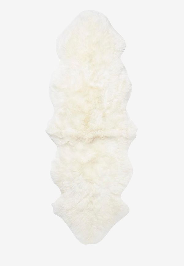 Riktigt fin skinnwille matta i vit färg gjord i fårskinn.