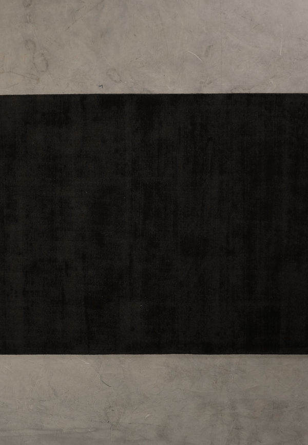 Mörkbrun Sofacompany-matta i ikonisk modell.