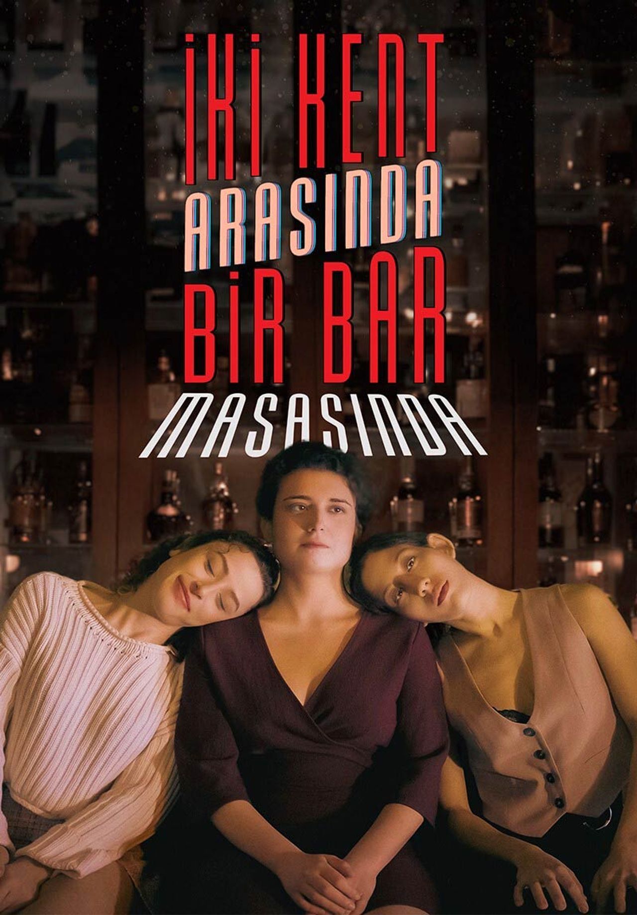 İki Kent Arasında Bir Bar Masasında