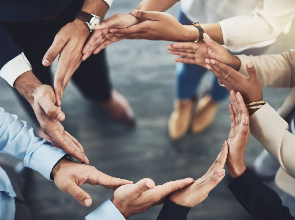 A circle of hands signifying unity