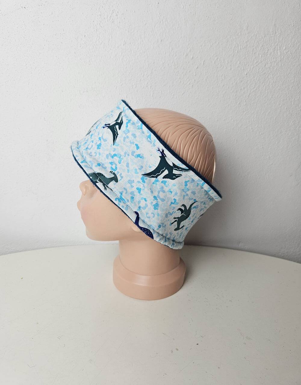 Stirnband aus Jersey blau gesprenkelt mit Dinos Stirnband aus Jersey blau gesprenkelt mit Dinos
