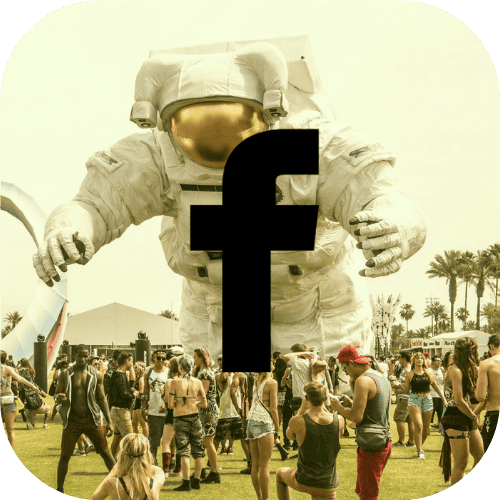 A crowd gathers on a lawn while an inflatable spaceman towers above them