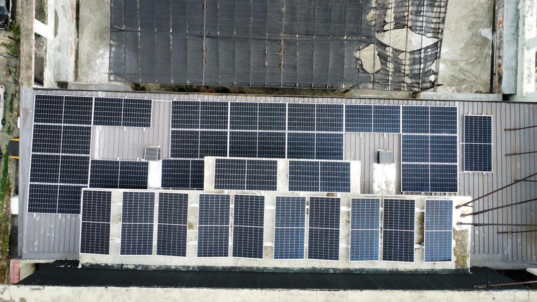 Commercial rooftop solar panel installation at Redwood Pharmacy, Kuchai, by Inhome Solar