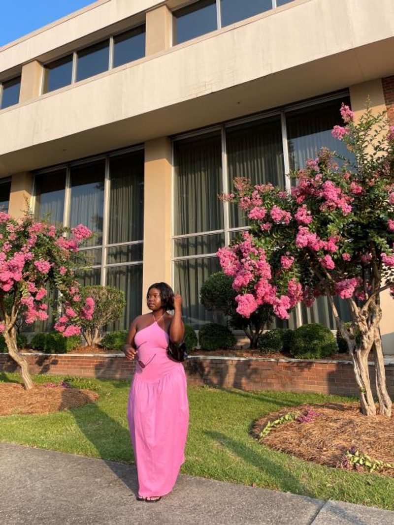 Juliana wearing a pink dress outdoors