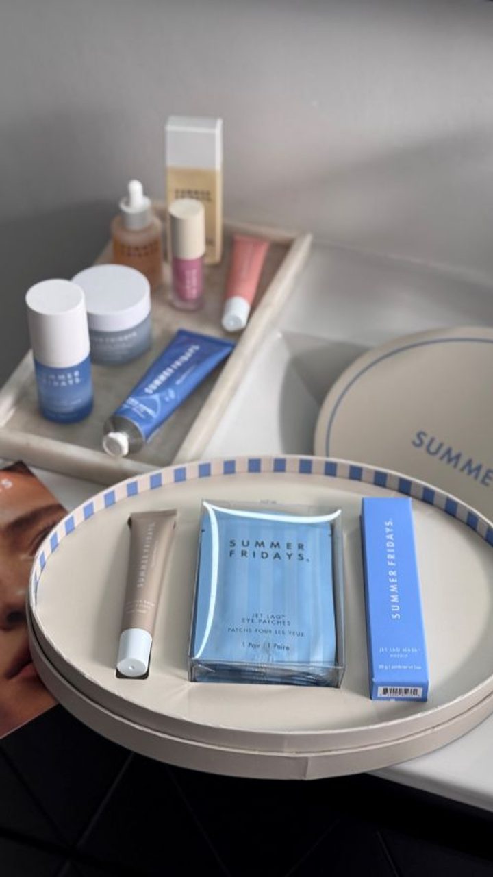Beauty products arranged on cream fabric