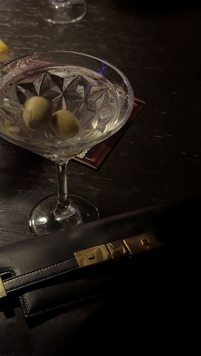 A cocktail and handbag during a New York evening