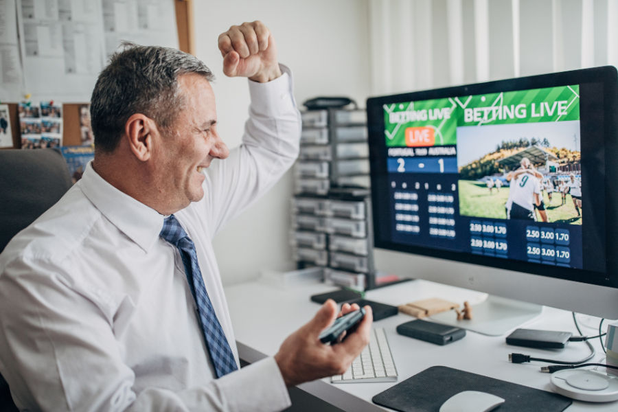 a person is happy about winning hockey betting