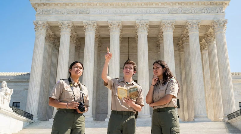 The front facade of the United States Supreme Court building with its iconic columns and the inscription Equal Justice Under Law carved above the entrance