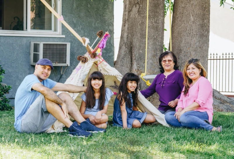 family sitting on yard in Plainfield NJ