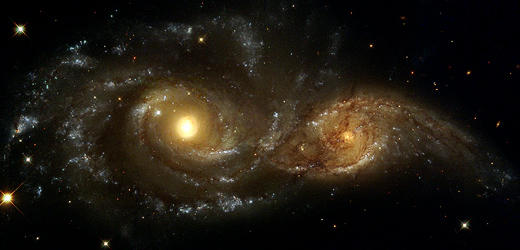 NGC 2207 and IC 2163 are a pair of colliding spiral galaxies about 144 million light-years away. In about a billion years time, they will merge and become an elliptical galaxy.