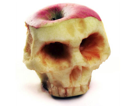 An apple that was hand carved and then shot! Nice!