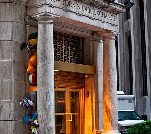 Performers at the New York Stock Exchange forming a “human sculpture” on Sunday during a piece entitled “Bodies in Urban Spaces” by choreographer Willi Dorner