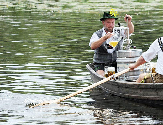 The Fischerstechen boat-jousting competition at the Staffelsee Lake in southern Germany from the Wall Street Journal Photos of the Day (Aug. 15)