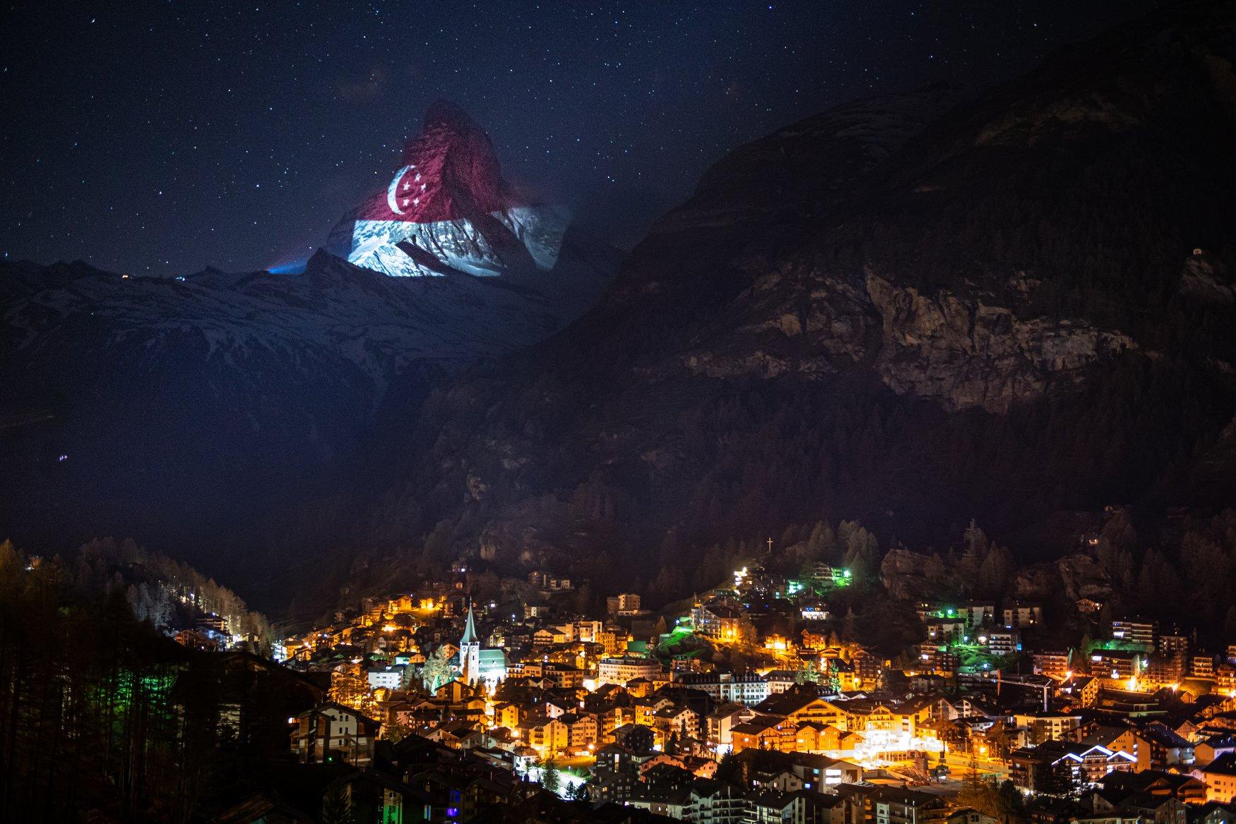 The Singapore flag projected on the Matterhorn