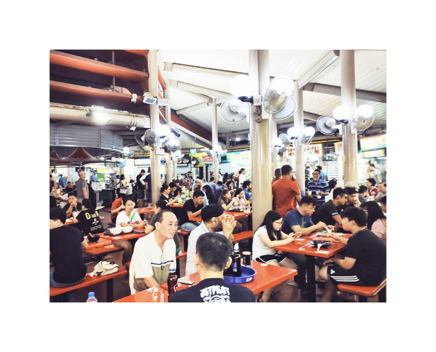 People eating at a crowded Adam Road hawker centre in November 2019