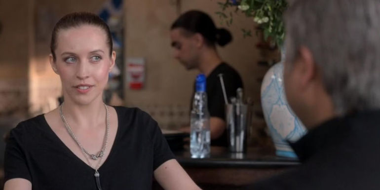 Edyta Budnik as Jade looking suspiciously at Nate in Ted Lasso