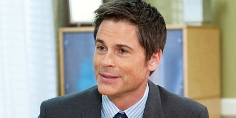 Closeup of Rob Lowe smiling as Chris Traeger in Parks and Rec