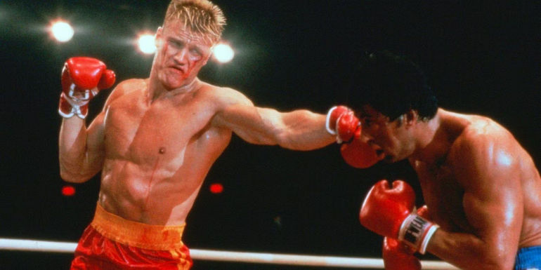 Dolph Lundgren as Ivan Drago punches Rocky in Rocky IV