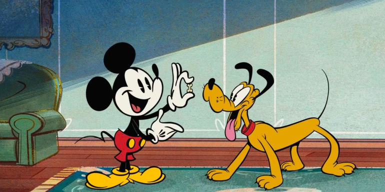 Mickey Mouse is offering Pluto a treat. 