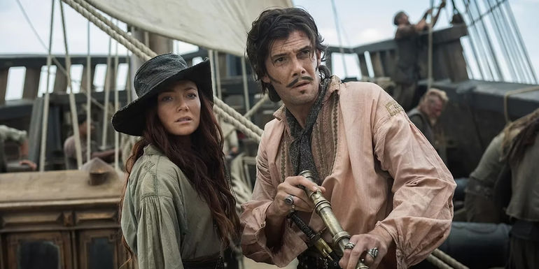 Calico Jack and Anne Bonny looking across the water in Black Sails