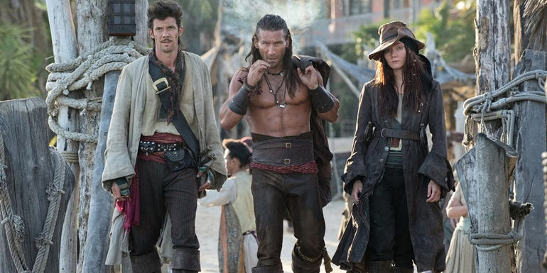 Calico Jack, Charles Vane, and Anne Bonny walk on the dock in Black Sails.