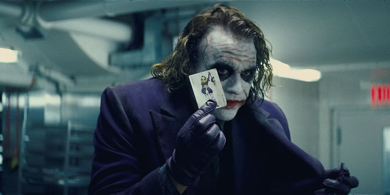 The Joker is holding up a playing card in The Dark Knight.