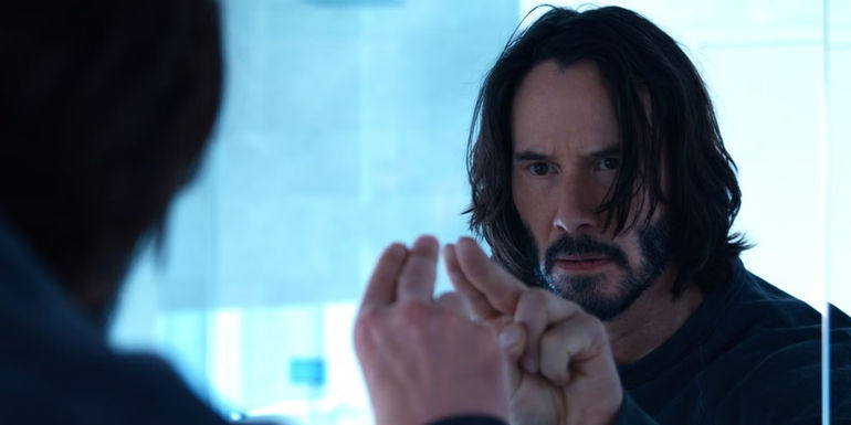 Neo looks at a mirror in The Matrix Resurrections