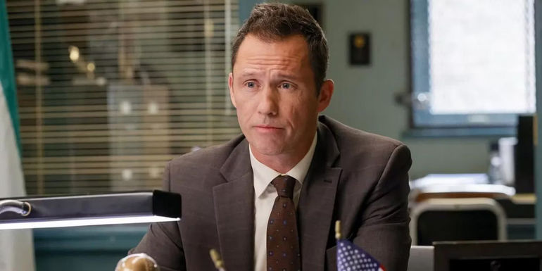Jeffrey Donovan as Detective Frank Cosgrove sits at his desk in Law & Order.