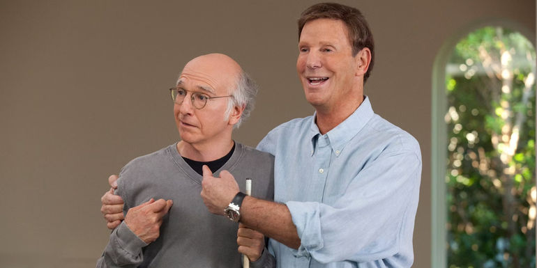 Marty Funkhouser hugging Larry in Curb Your Enthusiasm