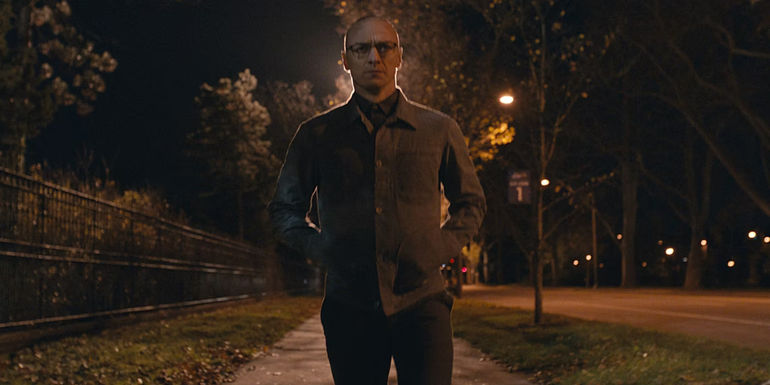 James McAvoy standing in the street at night in Split