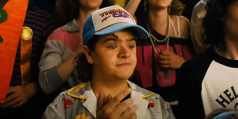 Dustin Henderson clapping in Stranger Things season 4