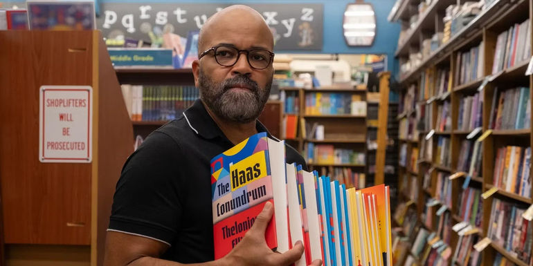 Jeffrey Wright holding books in American Fiction