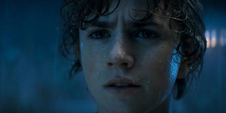 Percy standing in the rain looking at Kronos in his dream in Percy Jackson episode 1