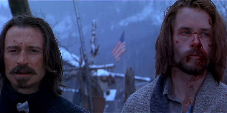 Captain Boyd and Colonel Ives standing outside in Ravenous