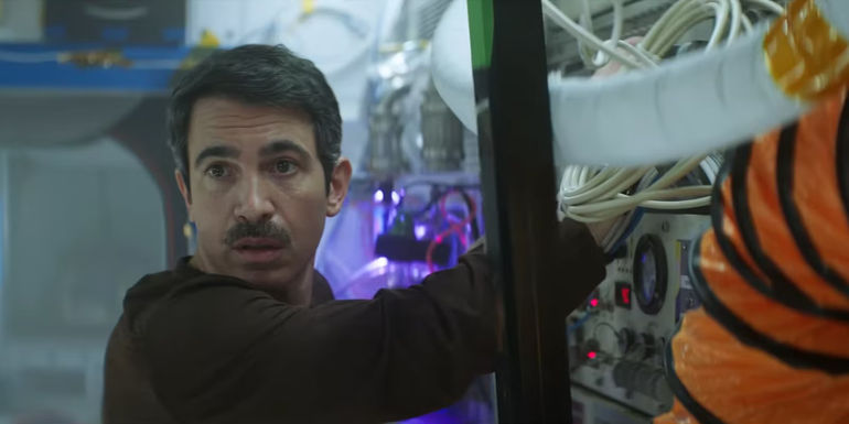 Gordon looks over his shoulder while visibly upset in I.S.S.