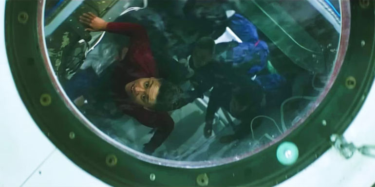 Kira looks up through a window in I.S.S.