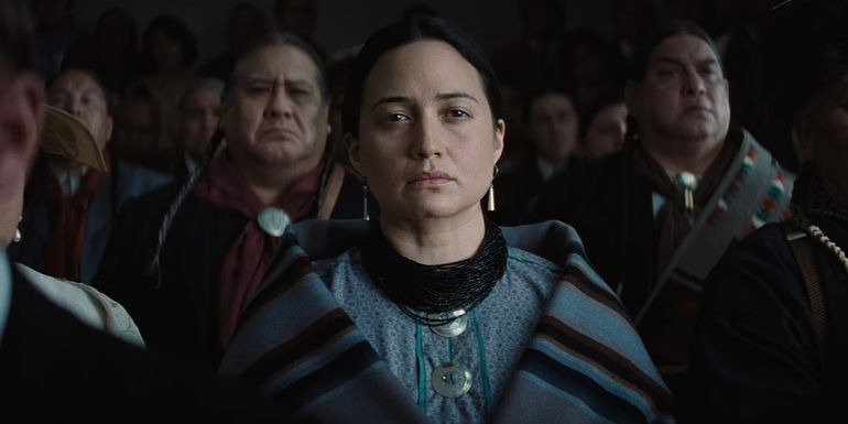 Lily Gladstone as Mollie looking somber in Killers of the Flower Moon