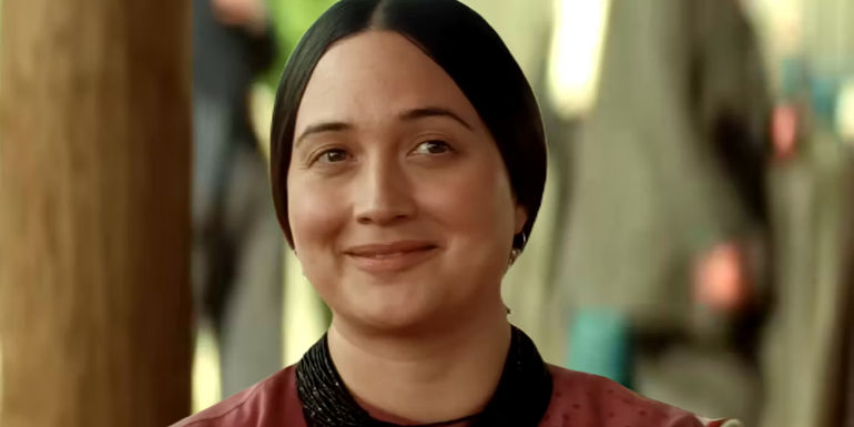 Lily Gladstone as Molly Burkhart smiles in Killers of the Flower Moon.