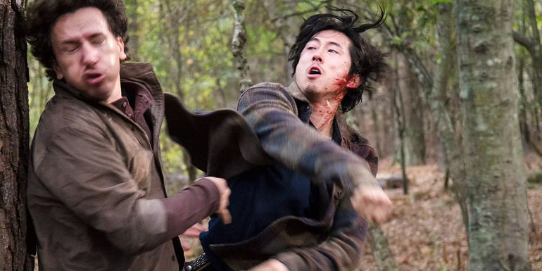 Steven Yeun as Glenn punching Nicholas (Michael Traynor) in the Walking Dead