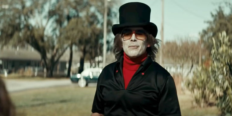 Ethan Hawke as Grabber wearing a top hat in The Black Phone