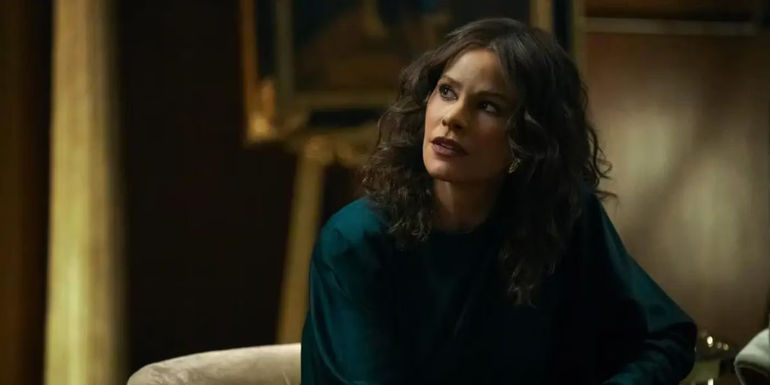 Sofía Vergara as Griselda Blanco listens to concerning news in Griselda.