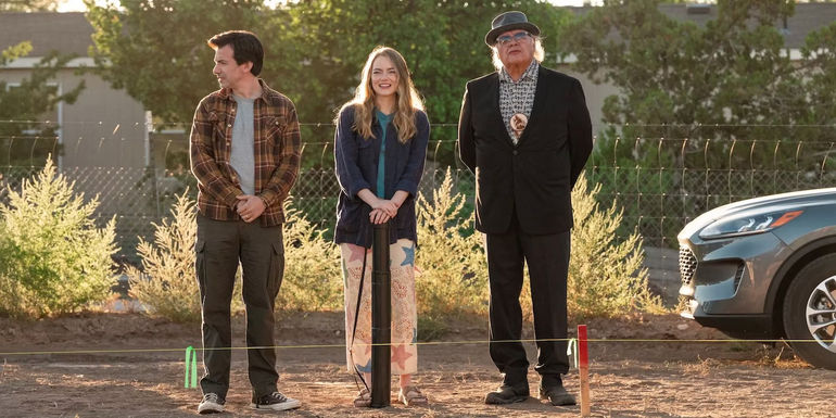 The Curse Emma Stone and Nathan Fielder standing behind a property line