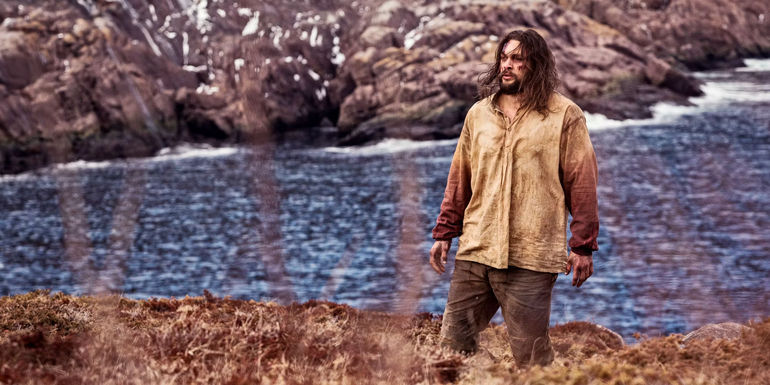 Jason Momoa's Declan Harp standing by a river in Frontier season 1.