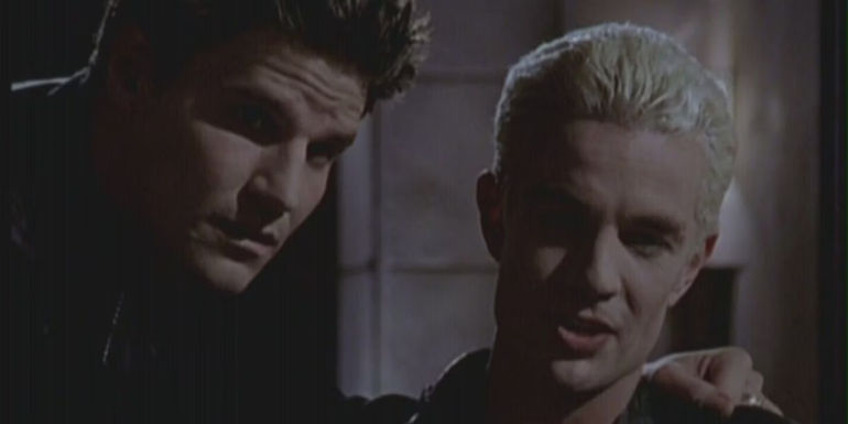 Angel with an arm around Spike's shoulder