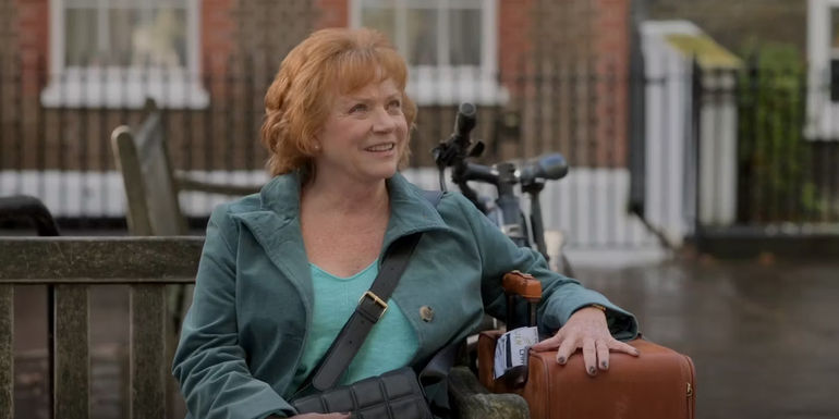 Dottie Lasso (Becky Ann Baker) sitting and smiling in Ted Lasso season 3, episode 11