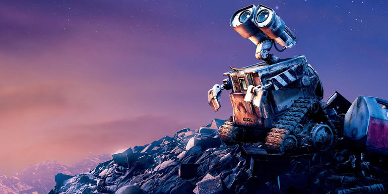 WALL-E looking up at the stars on a pile of trash.